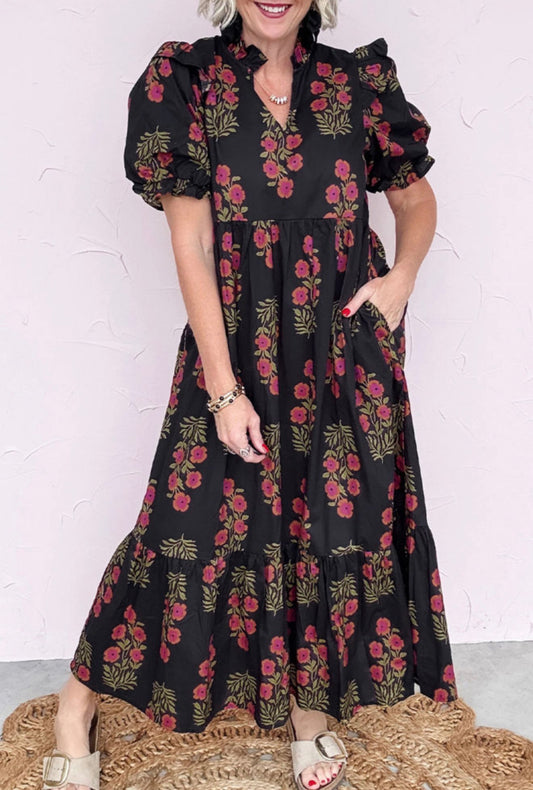Long black dress with floral print, short puff sleeves and layers